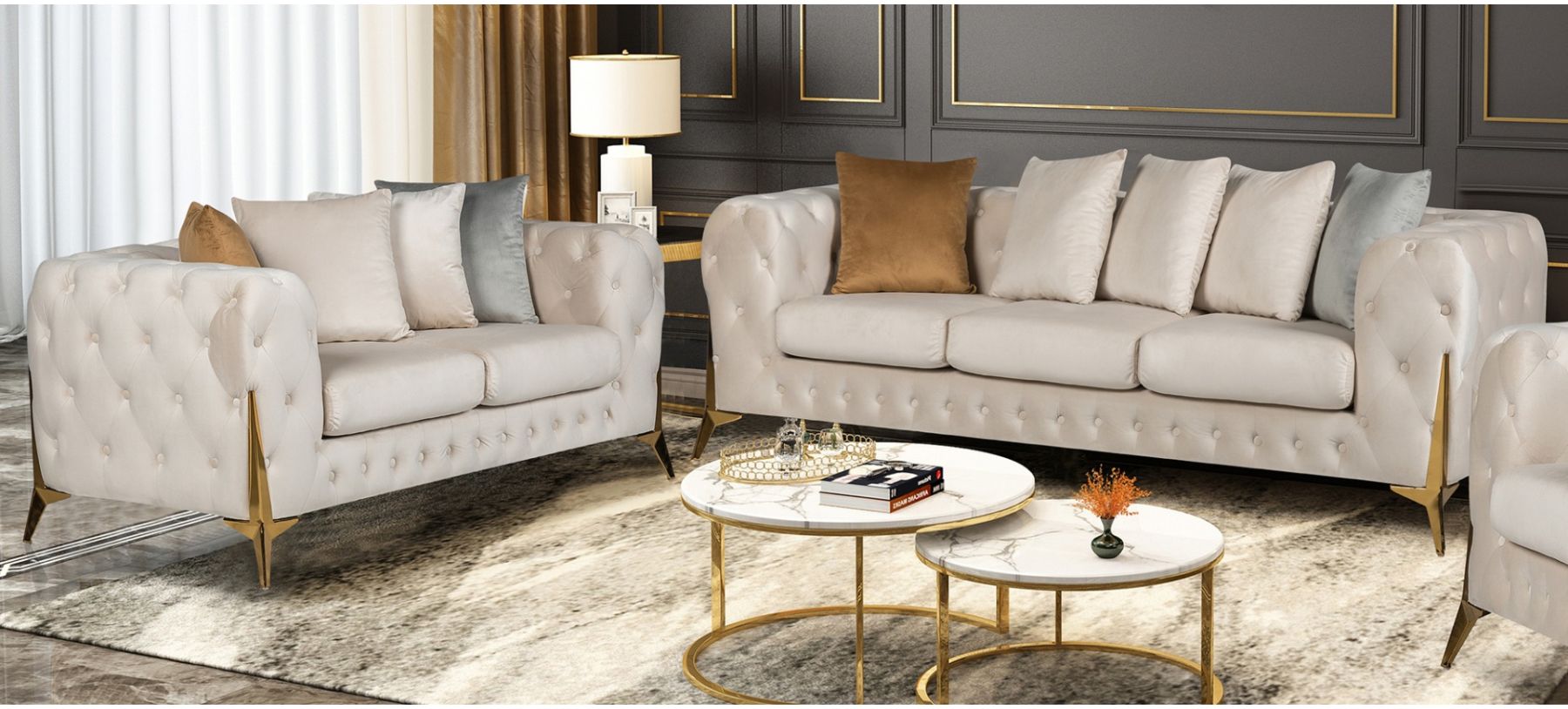 Cream sofa set with decorative pillows in a living room setting.