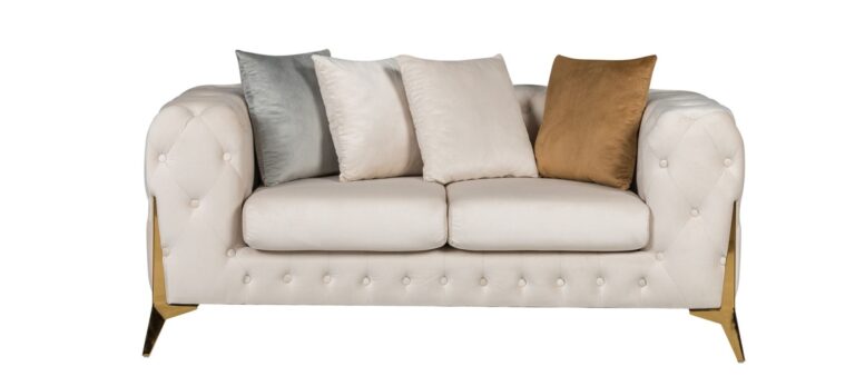 Cream sofa with decorative cushions on a white background