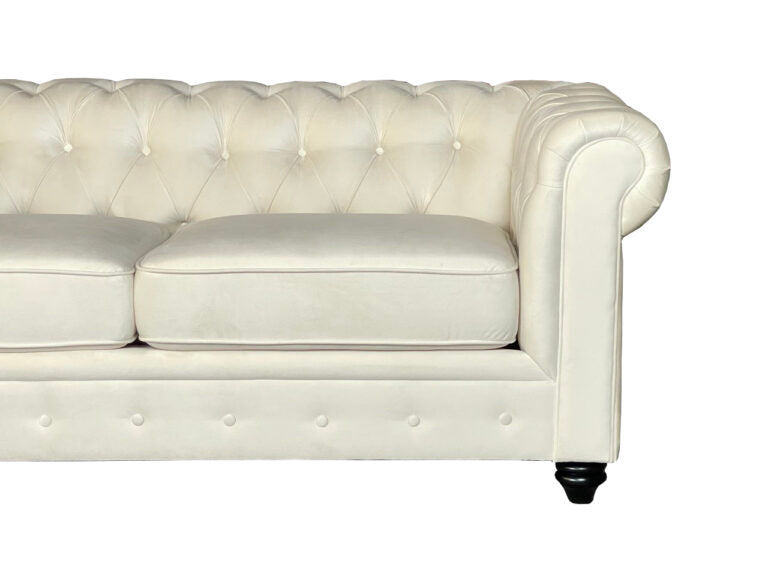 White leather sofa with tufted backrest on a white background